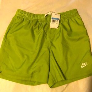 Nike standard fit above the knee green shorts with pockets. Size M